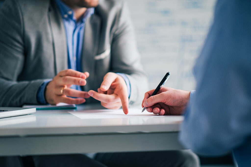 Business consultant and customer on a meeting in the office, sig